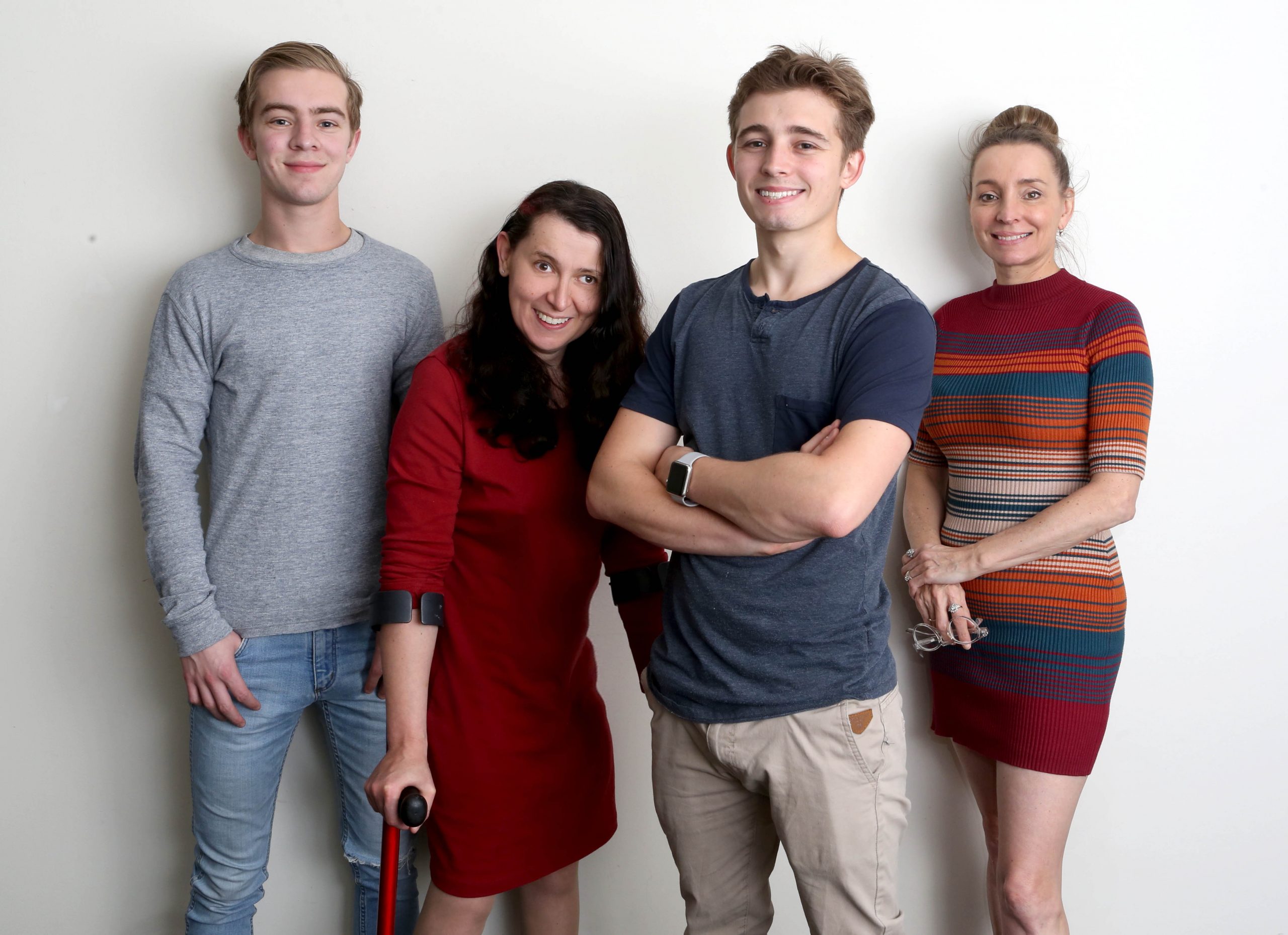 The Intimate Encounters Team stand in a line smiling camera against a white background