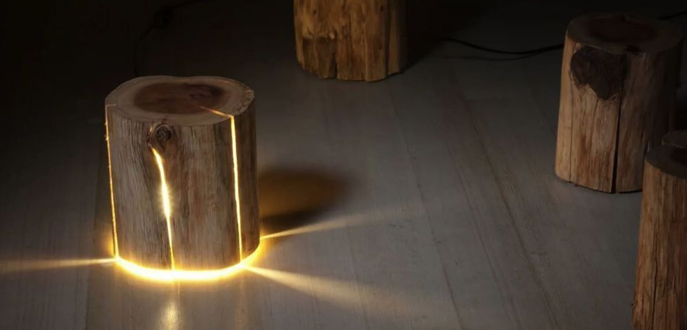 Image shows a cylinder with light sitting on a white floor.