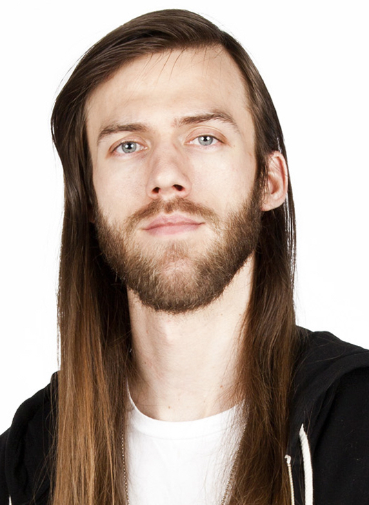 a head shot of a white man with long brown hair