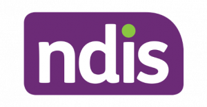 white letters n, d, i and s in a purple rectangle with rounded edgs. The dot above the i is green