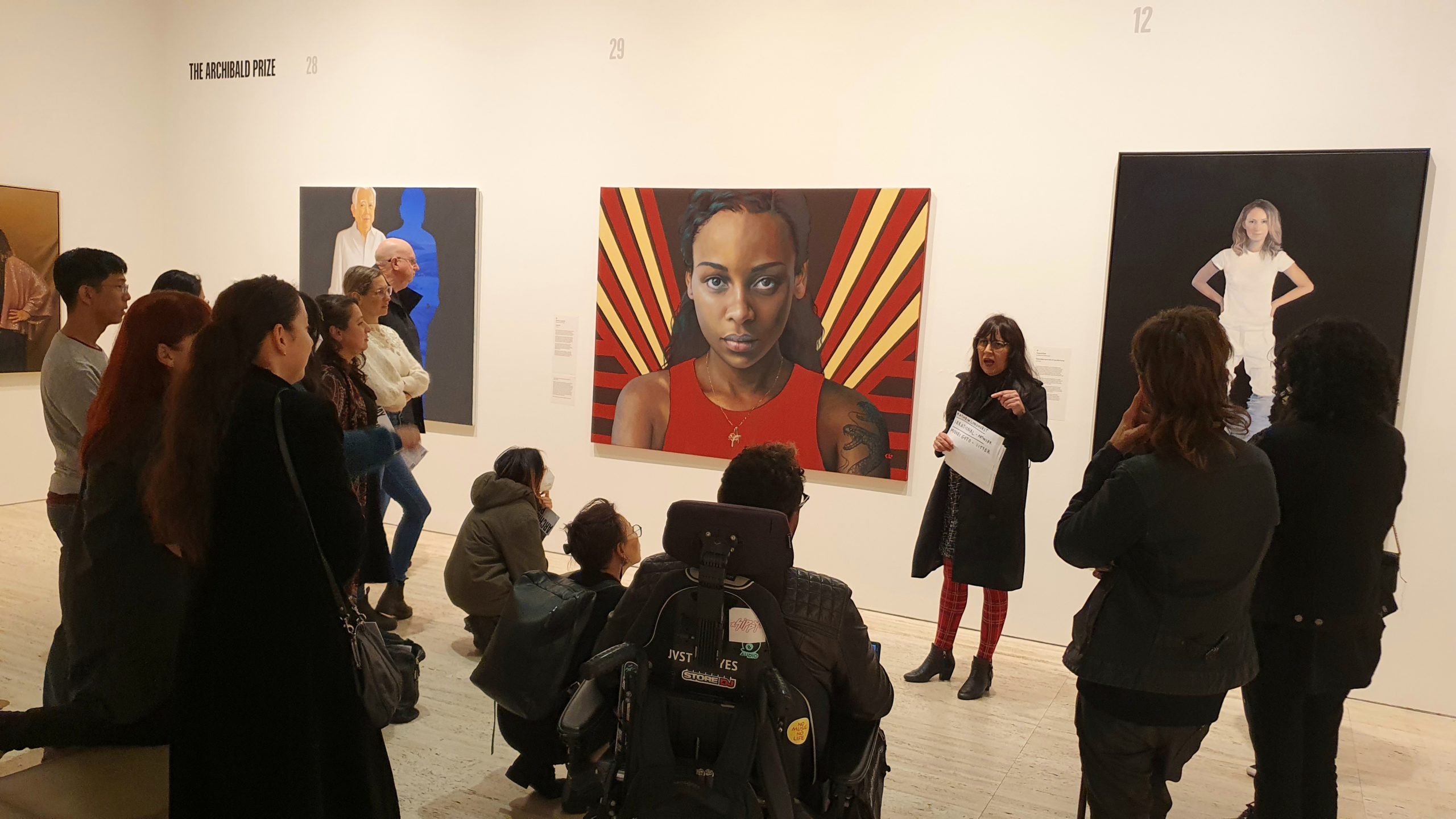 Artist Angie Goto leads a tour of the Archibald Prize 2022